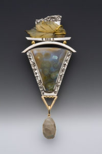 earth toned pendant with silver accents by Caryn Hetherston