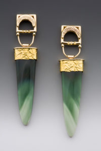 A set of green earrings with gold clasps by Caryn Hetherston