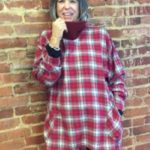 Gretchen Hulse wearing a red plaid tunic