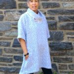 Gretchen Hulse wearing a white spotted tunic