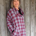 Gretchen Hulse wearing a red plaid long sleeve sweatshirt