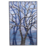 Marbled blue and purple stained glass panel with a foil wrapped glass tree with long branches and a shadow effect of two trees behind. Created by Sally Warner