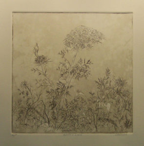 This etching of flowers on a metal plate was inked, then transferred to cotton paper. Created by Maryann Cannon.
