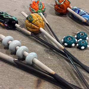 Glass beads on metal rods