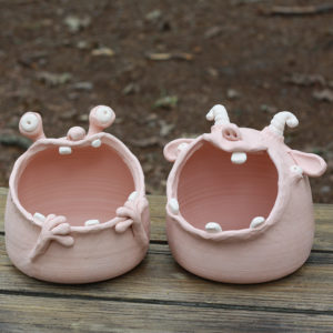Two ceramic monster bowls with wide mouths and tiny teeth