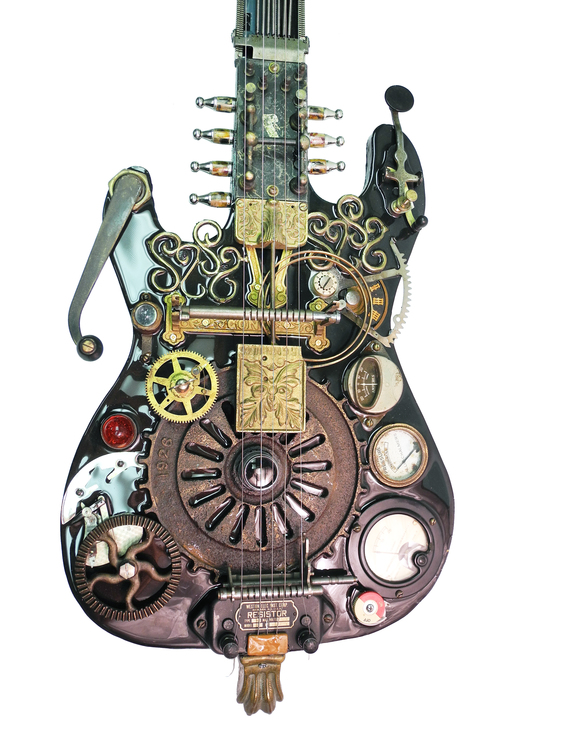 Found object sculpture of a guitar with metal gears and embellishments of various sizes, by Larry Agnello