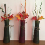 Three decorative vases with glass plants inside by Deborah DiMarco