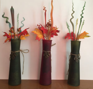 Three decorative vases with glass plants inside by Deborah DiMarco