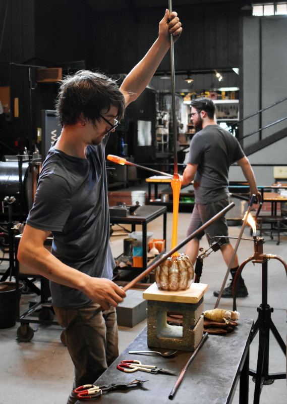 Glass artists Brian and John making pumpkins in the Glass Studio