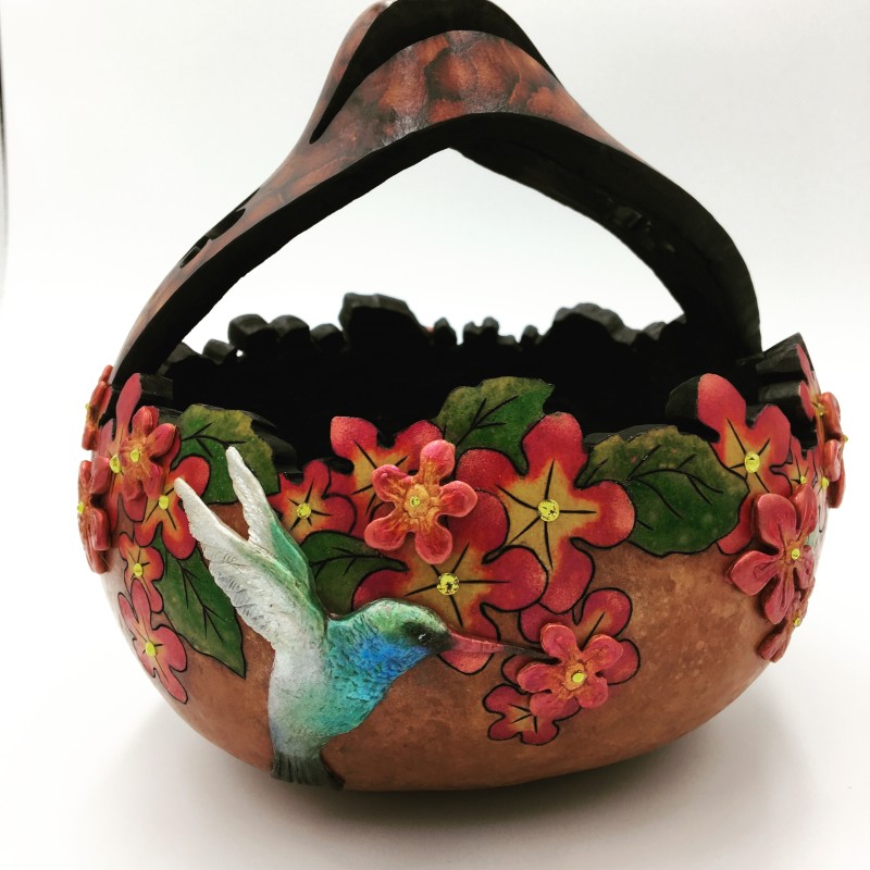 Carved and painted gourd basket decorated with painted flowers, leaves, and a hummingbird, created by Barbara Lovelace