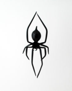 A flamework glass spider with a black body by Thomas Von Koch