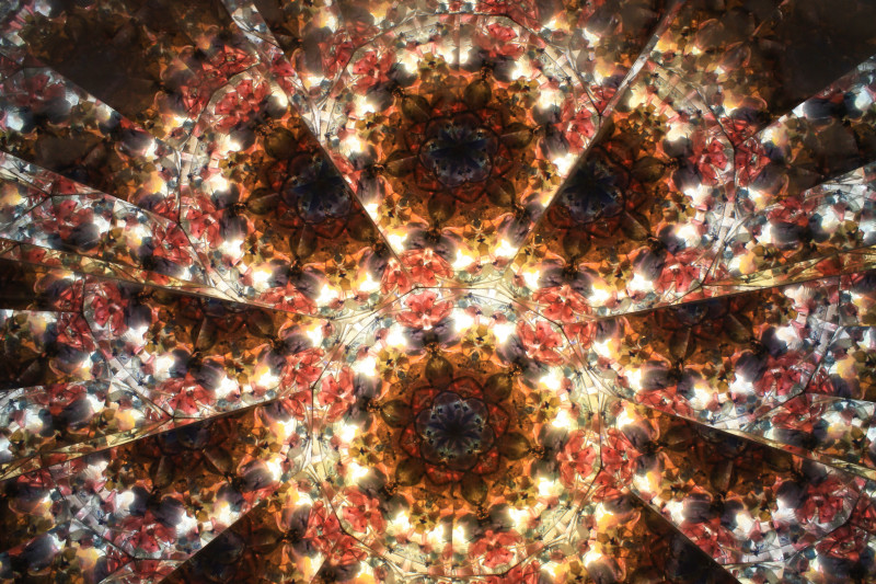 Close-up view of kaleidoscope image generated by the drum filled with red and yellow cullet.