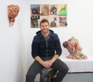 Medium shot of Jesse Krimes, participating artist in special exhibition, "Emanation 2019"