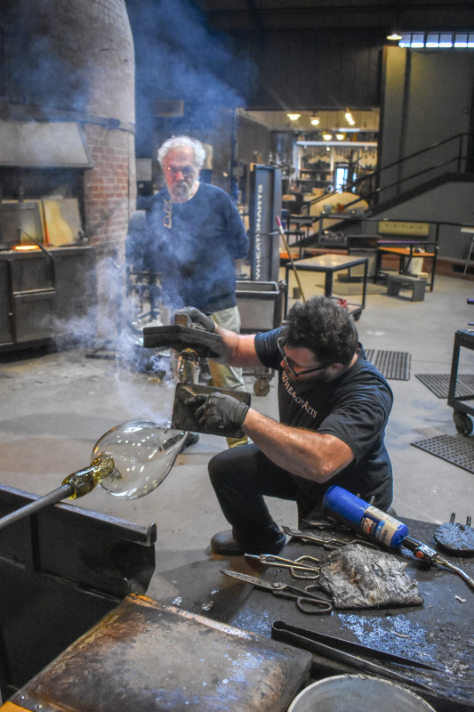 "Emanation 2019" Artist Allan Wexler observes WheatonArts Glass Artist Skitch Manion shape glass.