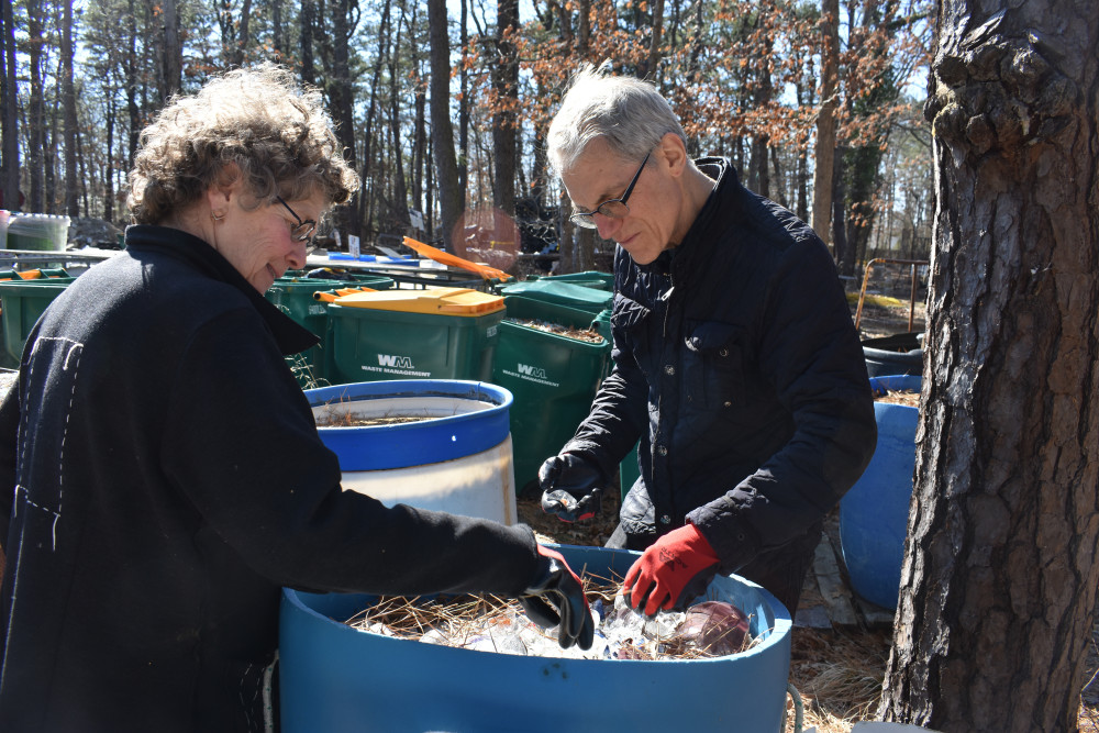 Emanation 2019 curator Julie Courtney and artist Richard Torchia sorting through cullet.