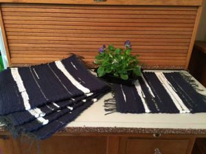 Blue and white mats woven by Belinda DeCicco