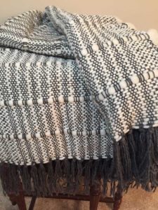 A black and white blanket folded over itself by Belinda DeCicco