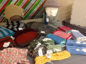 A collection of hats, gloves, and scarves by Annette Devitt