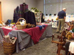 A booth showcasing the fiber art of Annette Devitt