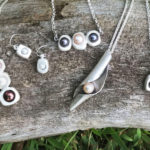 A collection of silver metal clay jewelry . Created by Sue Fontana.
