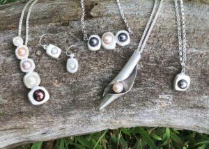 A collection of silver metal clay jewelry . Created by Sue Fontana.