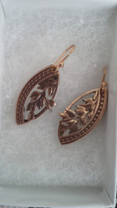 Metal earrings carved by Allan Feinberg with a matching leaf motif