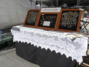 Booth showcasing Allan Feinberg's "Art in Coin"