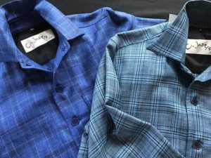 Two blue button up shirts by Catherine Joseph