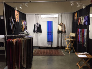 A booth showcasing the fiber art of Maureen Kamerick