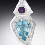 A silver pendant by Paul Lorber decorated with blue and purple faceted gemstones