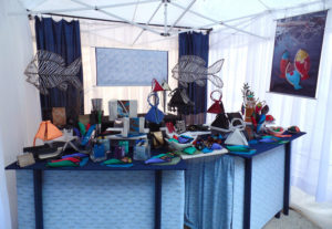 Booth displaying the leather goods of Lisa Strauss