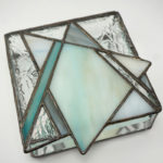 elegant box made of shining silver and soft teal glass, created by Jill Tarabar