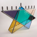 Glass menorah shaped like a star of David, created by Jill Tarabar
