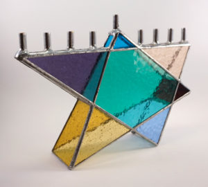 Glass menorah shaped like a star of David, created by Jill Tarabar