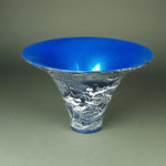 A wide mouth vessel by John Baun. The inside is a bright blue and the outside has a marbled blue and white design.