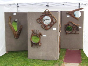 Booth showcasing the wood work of Gilbert Carey.