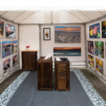 Collection of photography by Christopher Costa in a booth setting.