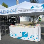 A booth showcasing the products of LEH Soap Company.