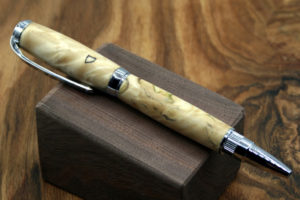 A closeup of a smooth tan wooden pen. Created by Thomas Ferrie.