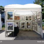 A booth showcasing the photography of Michael Leu.