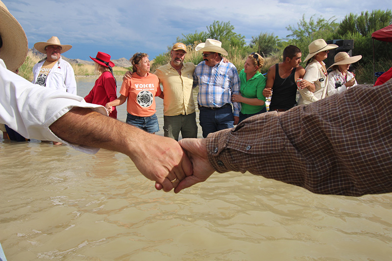 Americans and Mexicans join hands across the Rio Grande, 2014. Lorne Matalon