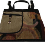 A black and brown patterned purse with a black trim, handle, and strap, created by Agustin Ruiz.