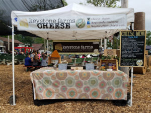 A booth displaying the goods of Keystone Farms Cheese