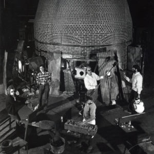 Black and white photo of the first class of Creative Class Fellows working in the Glass Studio in 1983.