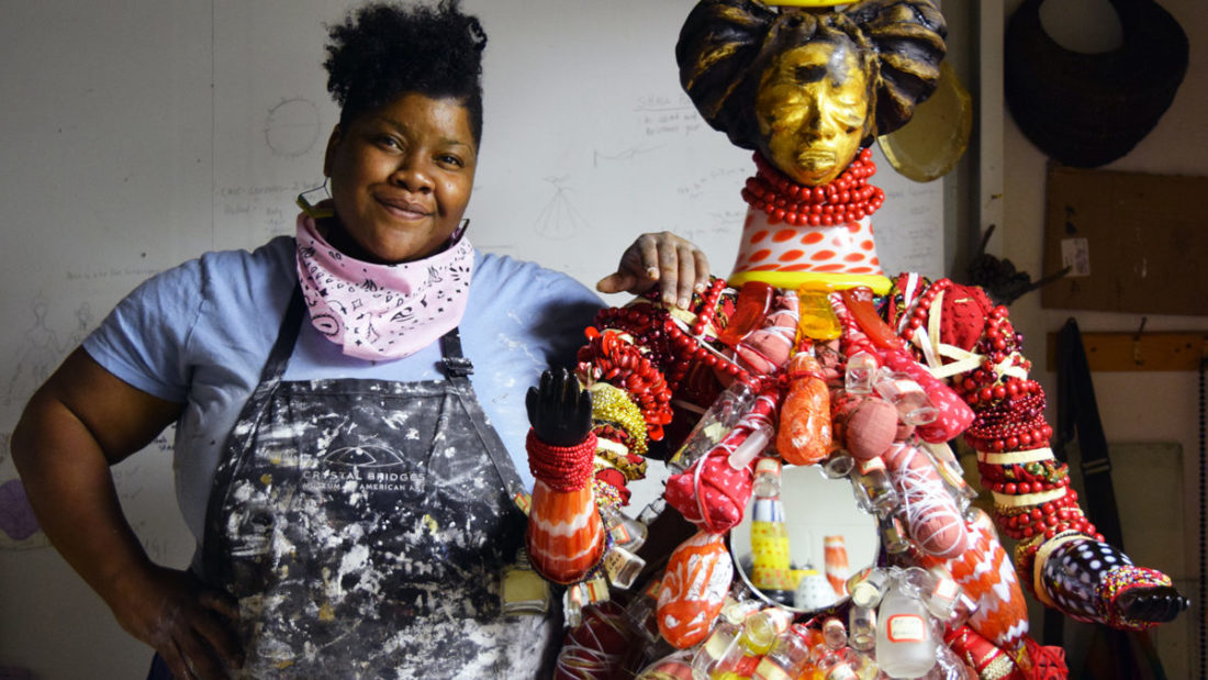 Emantion 2017 artist Vanessa German with one of her red and gold glass dolls.