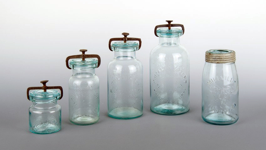 Five transparent blue jars of varying heights. Millville Atmospheric Fruit Jars and Millville Improved, Whithall, Tatum, & Co., c.1860