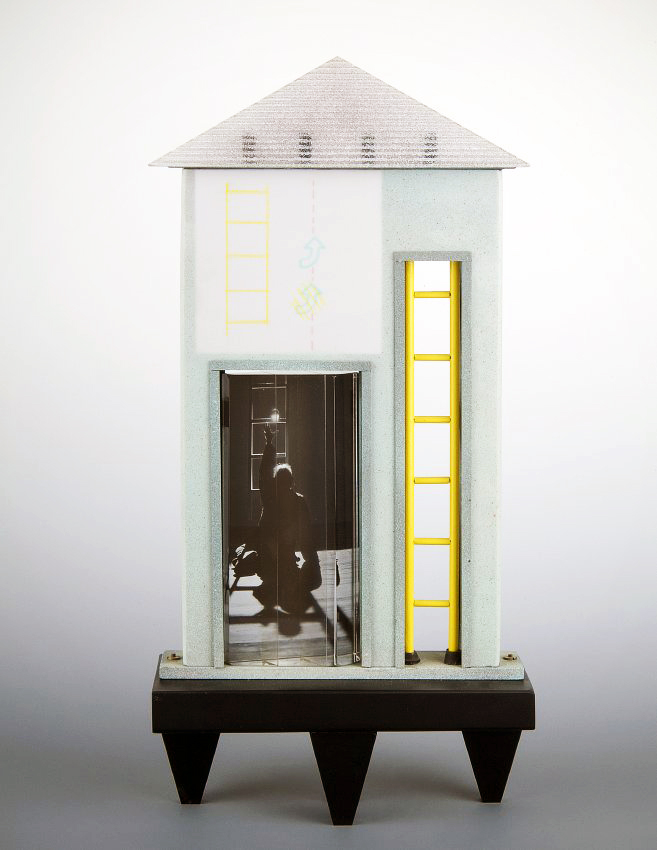 A sculpture of a house with a yellow ladder and a photo of a person in a room with a ladder on the left. Mary Van Cline, The Feeling of Direction, 1983, Photograph by Al Weinerman with The Lens Group