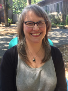 A headshot of Kristin Qualls, Director of Exhibitions and Collections.