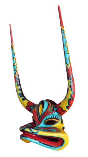 A transparent photo of "Toad", a multicolored papier-mâché, Dominican Mask with long horns by Francisco Jimenez.