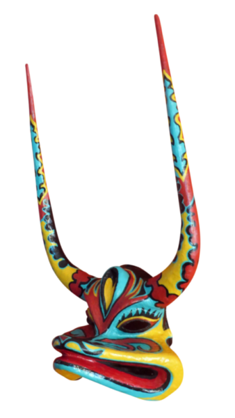 ToadprofileIMG_3078 A transparent photo of "Toad", a multicolored papier-mâché, Dominican Mask with long horns by Francisco Jimenez.